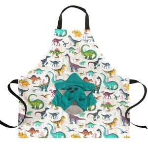 Tablier pour enfant à motif ''Dinosaures''. Doté d'une poche amusante au devant en forme d'un tricératops. Le tablier est ajustable à l'encolure à l'aide de boutons pressions. Il est offert en 2 grandeurs. Fabriqué au Québec.